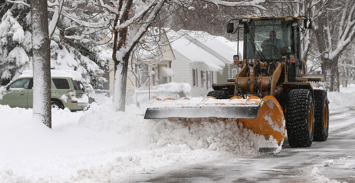 loader plowing snow