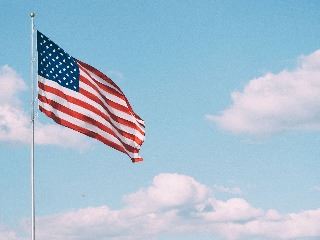 American Flag against a blue sky.